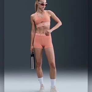 Nike Women's Coral Sports Bra and Shorts
